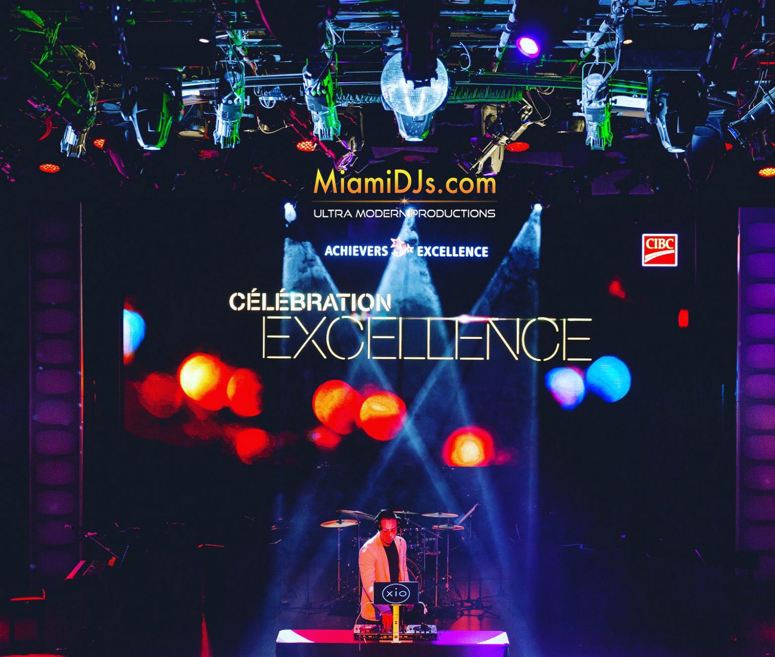 Awards gala stage with a branded LED screen and live band