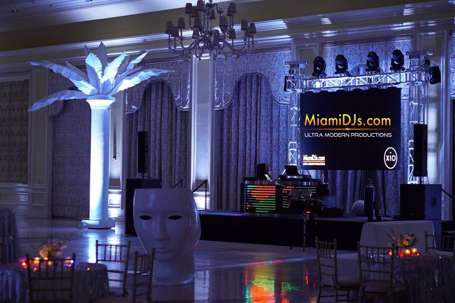 Company holiday party in a ballroom with an LED wall and custom lighting