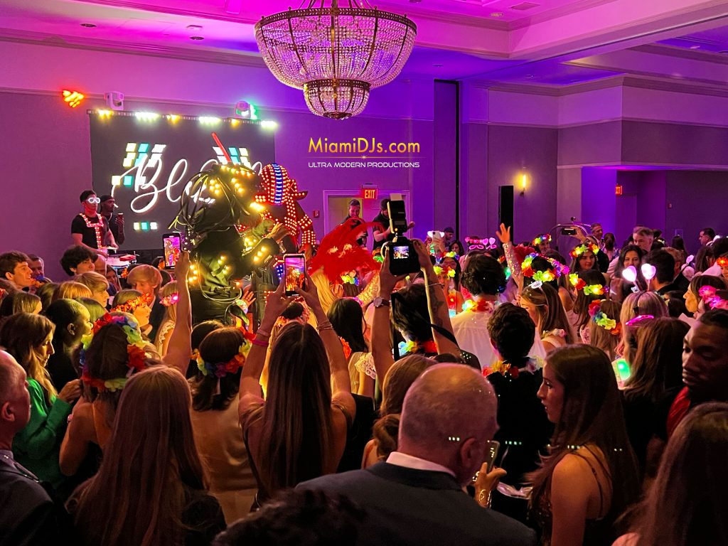 Packed dance floor with glow sticks