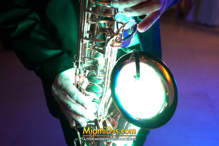Live saxophonist performing alongside a Miami DJs DJ