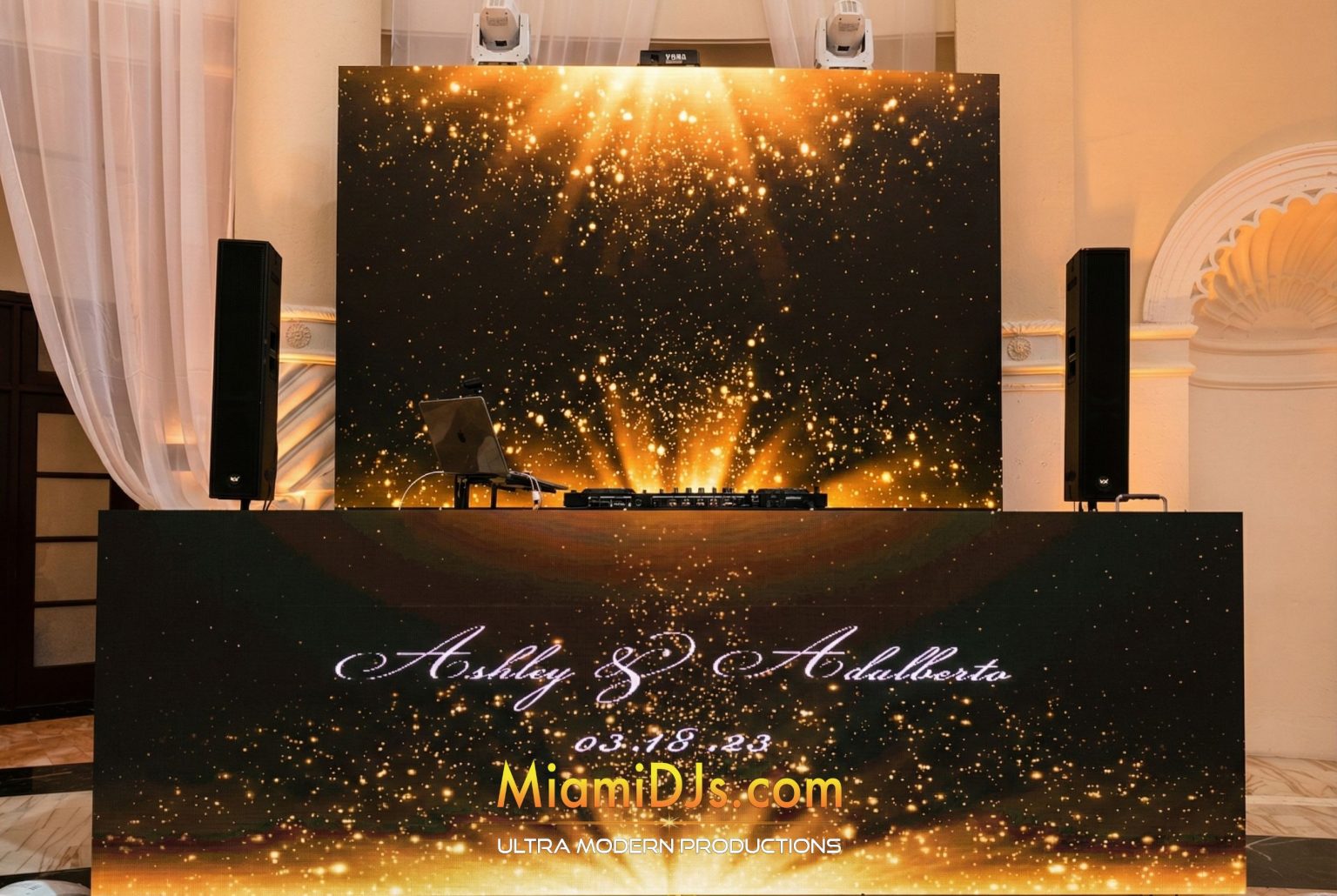 Signature setup with an LED booth in front and a wide LED wall behind the DJ