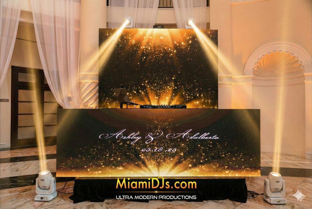 Gold sparkle backdrop behind a personalized LED wedding booth