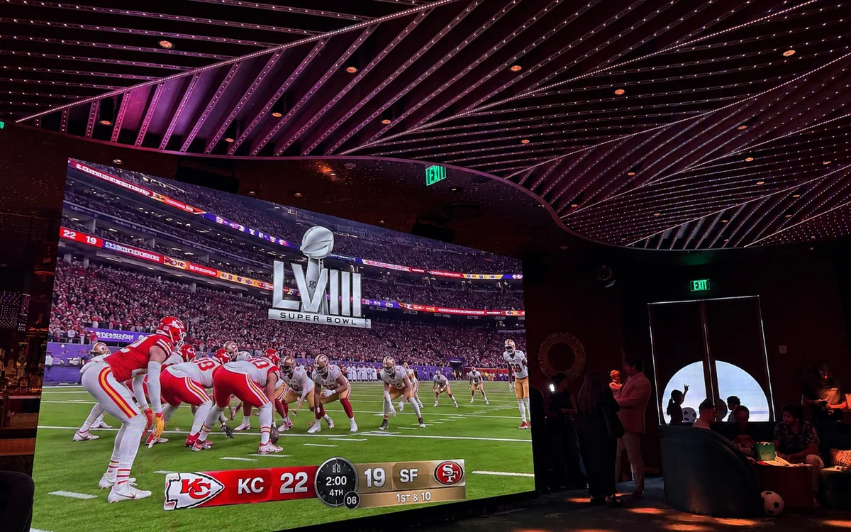LED video wall showing the Super Bowl live broadcast at a Miami lounge watch party