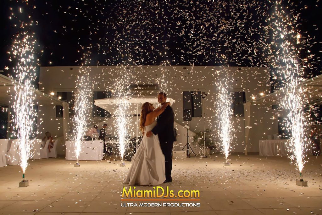 Cold sparkler fountains firing around a couple during their first dance