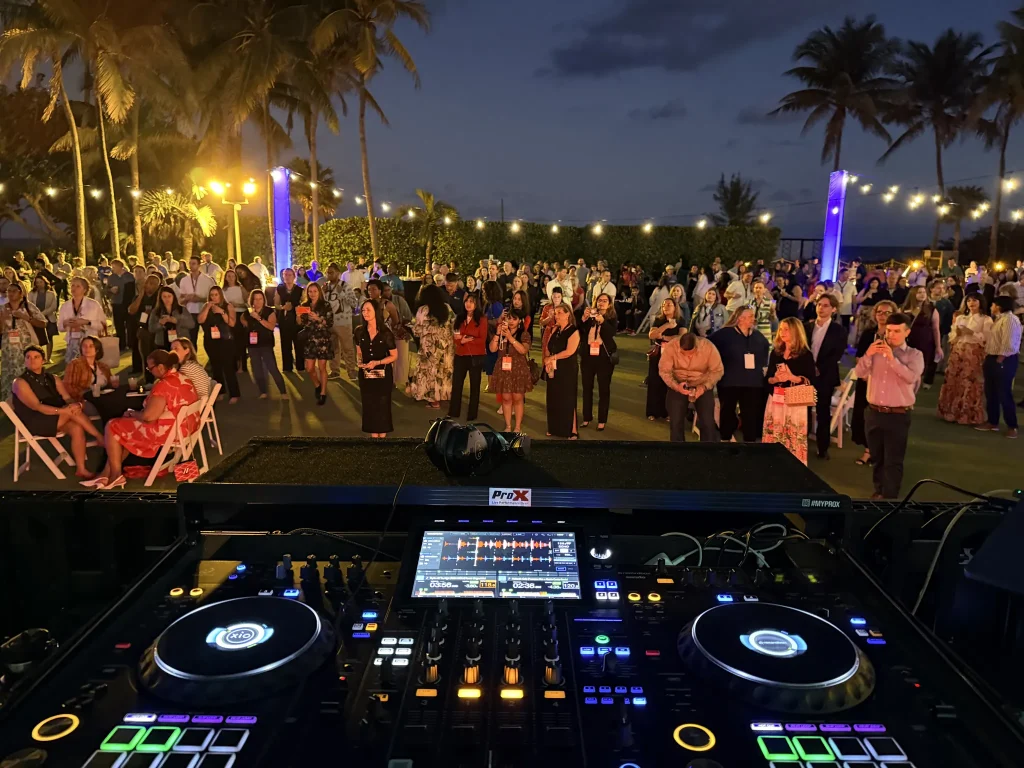 Corporate event crowd at Fontainebleau Miami Beach, seen from the DJ booth