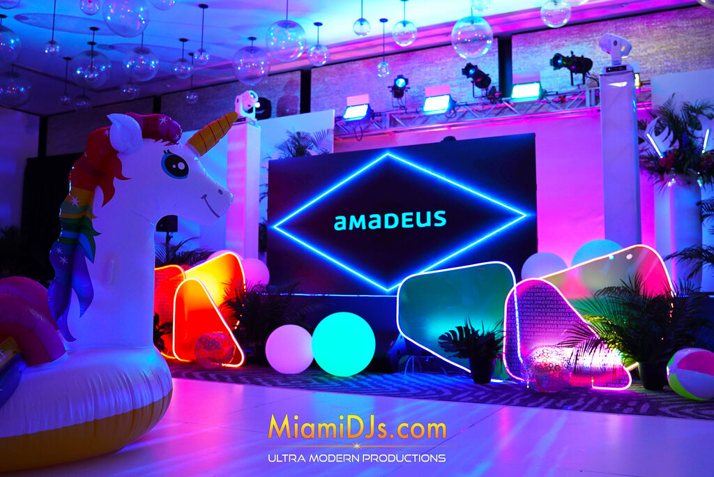 Branded stage with a company logo on the LED screen surrounded by custom neon decor