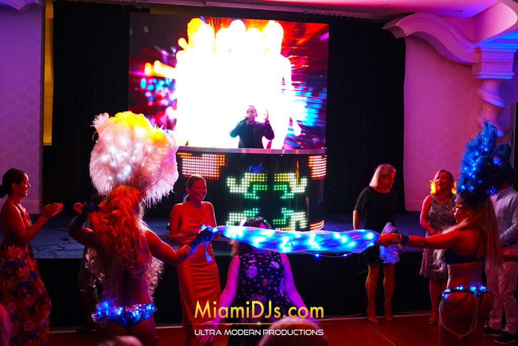 Full LED stage with performers during a corporate gala after-party