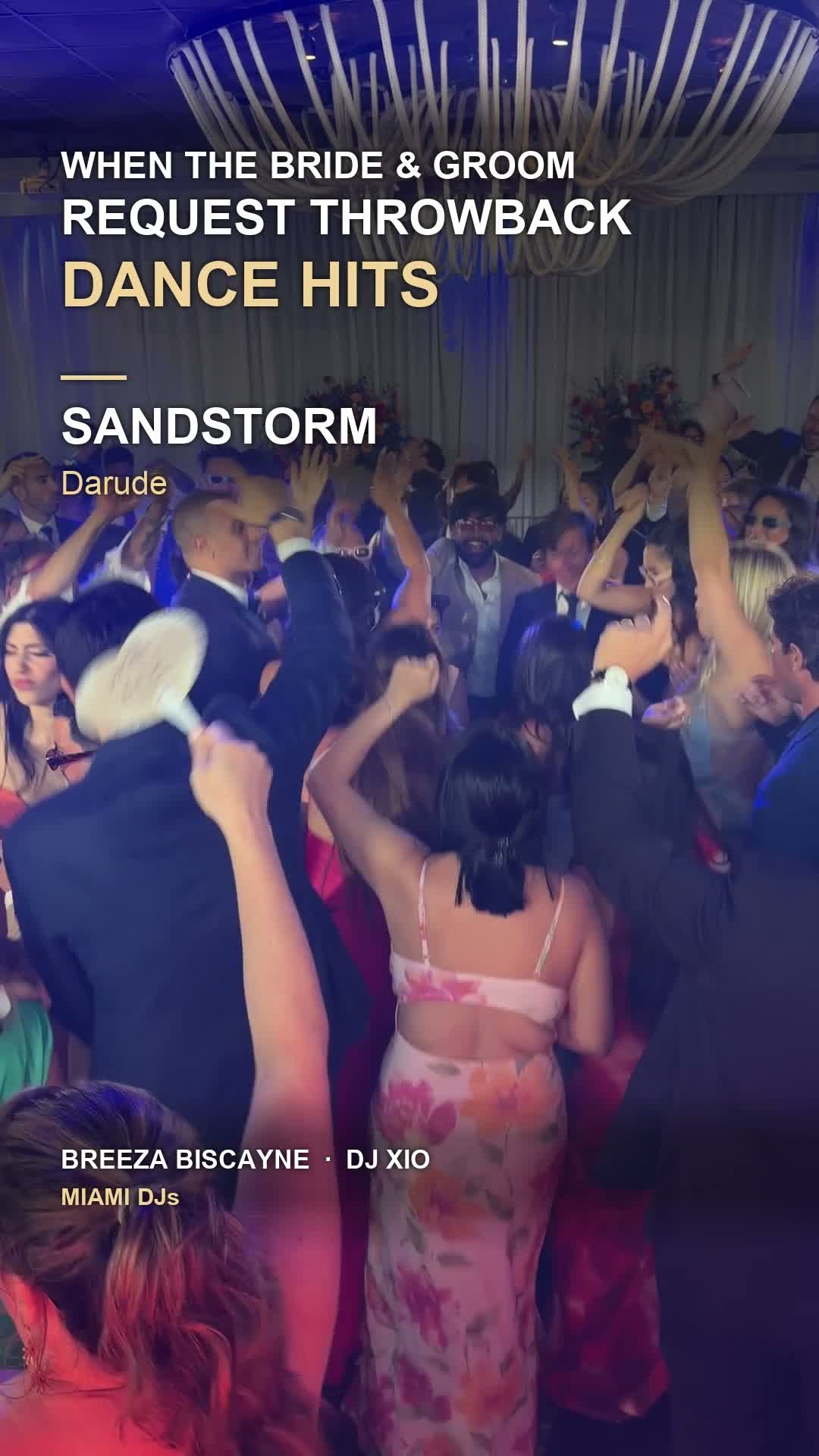 Wedding guests dancing and singing at Breeza Biscayne in Miami with DJ Xio.