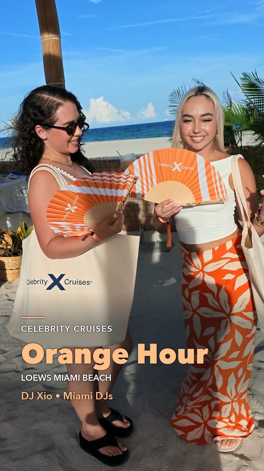 Guests at Celebrity Cruises Orange Hour at Loews Miami Beach holding orange fans and branded tote bags.